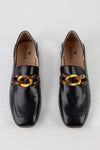 Heeled loafers with chain