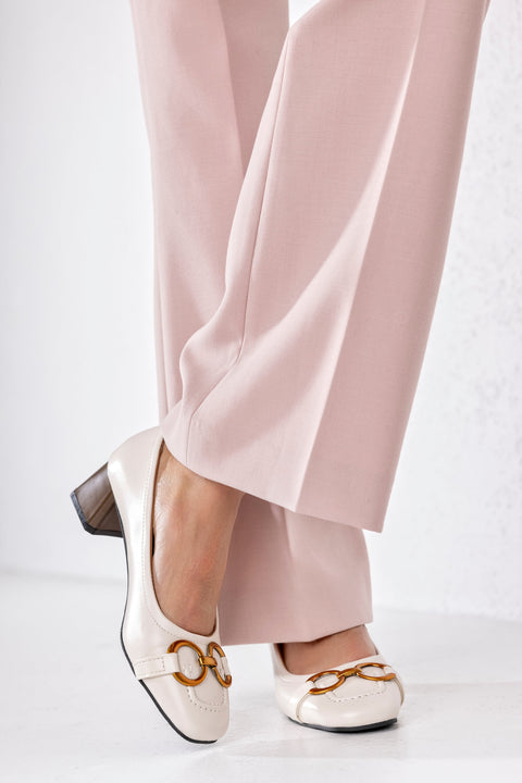 Heeled loafers with chain