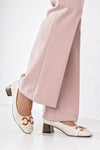 Heeled loafers with chain