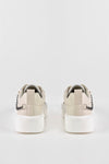 Lace-up fastening sneakers with chain on the side