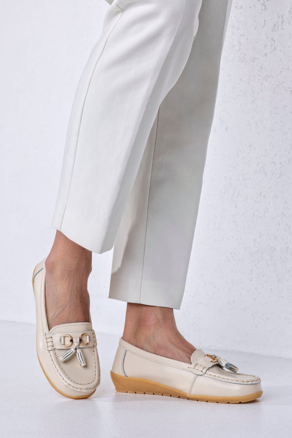 Mocassins en cuir à pompons