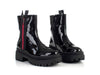 Boots with decorative zipper on side