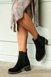 Leather boots with elastic at sides