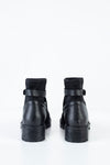 Boots with strap deccoration