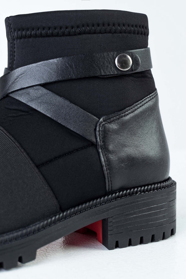 Boots with strap deccoration