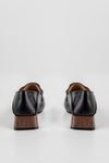 Heeled loafers with chain