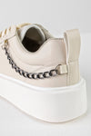 Lace-up fastening sneakers with chain on the side