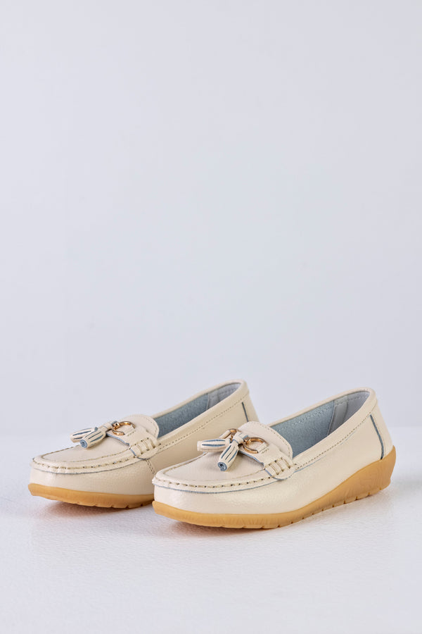 Mocassins en cuir à pompons