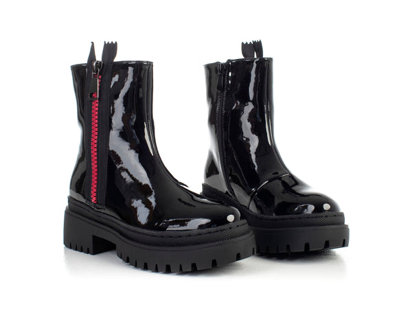 Boots with decorative zipper on side