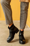 Boots with strap deccoration