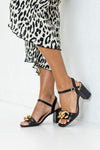 Heeled sandals with chain